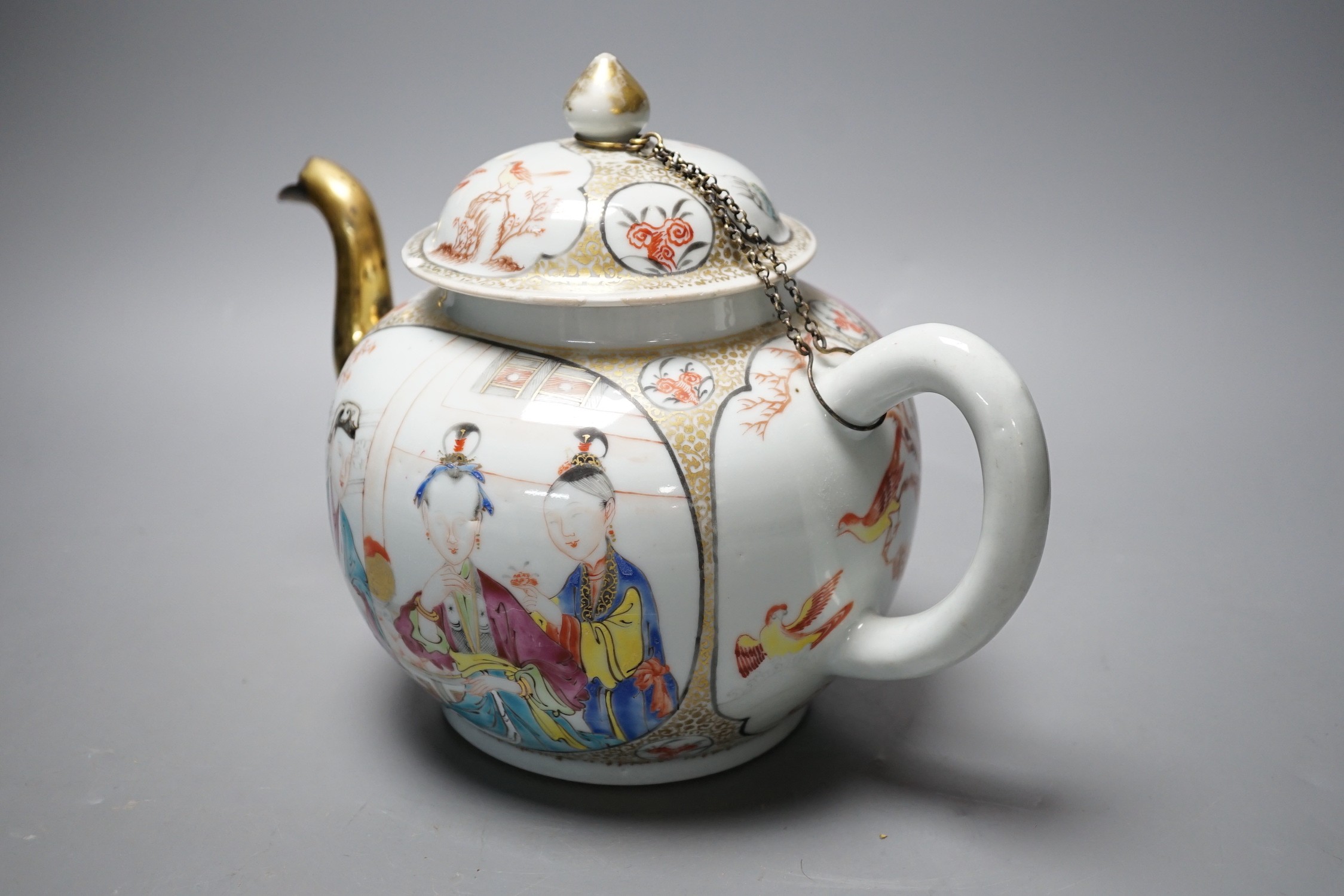 A large Chinese famille rose fencai teapot and cover, Qianlong period, replacement gilt metal spout, cover with restored chips, 20cm tall